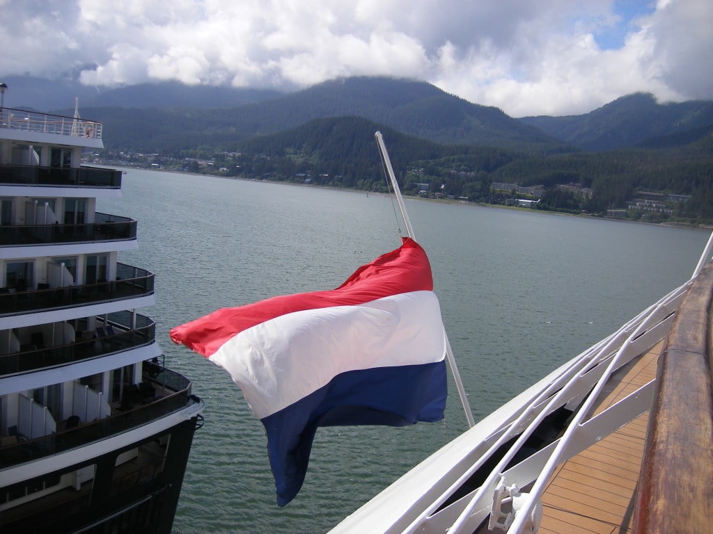 The flag of the ms Amsterdam at half mast