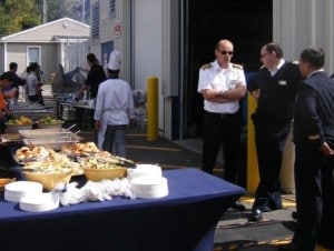 Captain Arno Jutten and Hotel Director Francaois Birarda supervising the cook - out