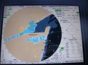 On this electronic chart capture you can see the dark blue where the ship docked in the L shape and the light blue below where the shuttle buses had to travel through the Marina