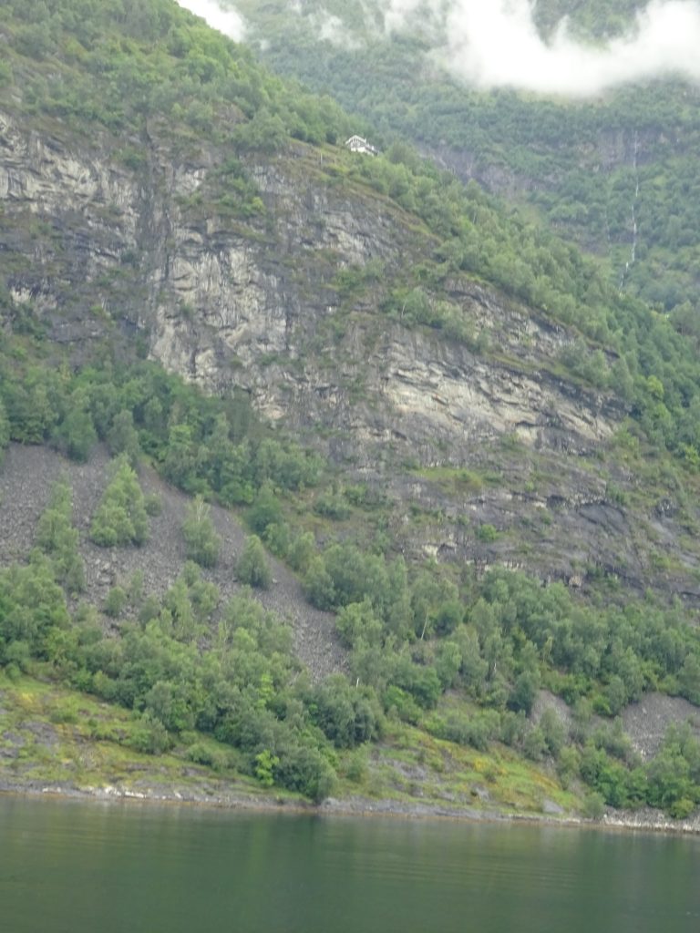 For me the most fascinating house in Geiranger Fjord. All by itself. Perched on the top of the mountain. I do not envy the newspaper boy who has to go there every morning on his bike.